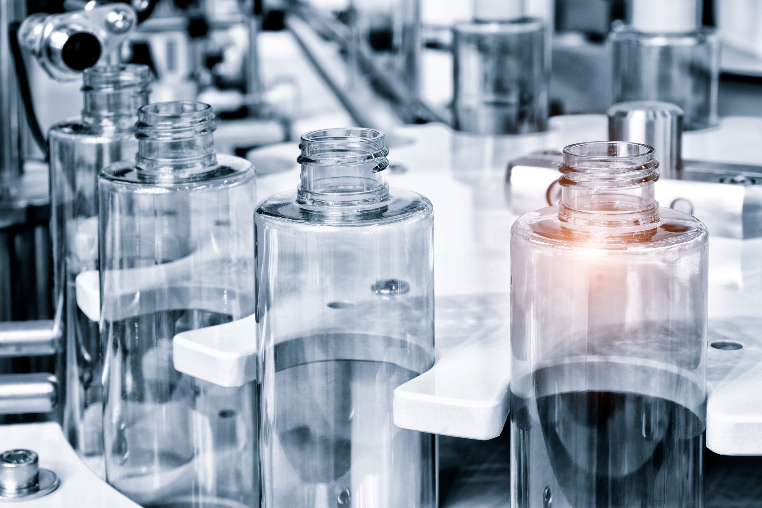 pharmaceutical industry, medicine pills are filling in the bottle on production line machine conveyor at the medical factory. selective focus.